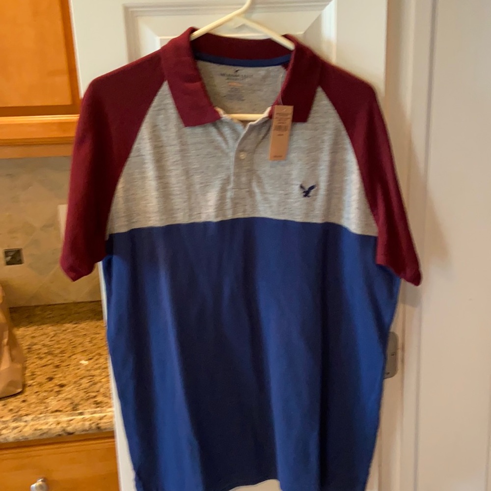 Brand new American Eagle Outfitters classic fit polo. Colorblock size medium.